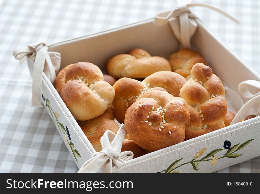Fancy knotted buns over special bread plate. Fancy knotted buns over special bread plate