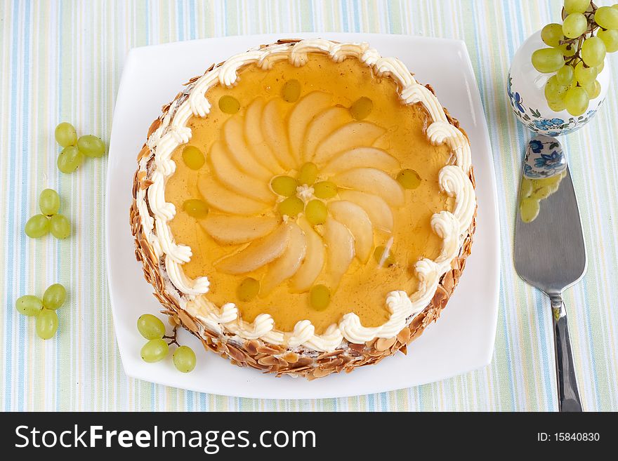 Biscuit Cake With Fresh Fruits Topping Under Jelly