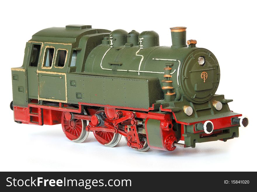 Vintage green model railway isolated on white background