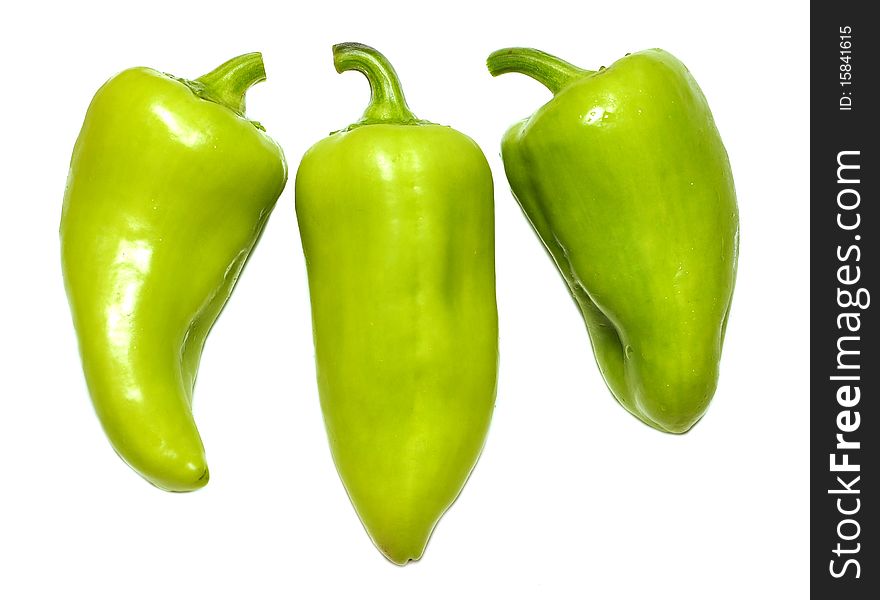 Three green peppers isolated on white background
