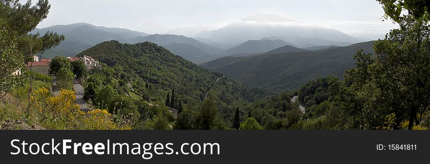 Panoramic view of villa in Corsica with mountains in background. Panoramic view of villa in Corsica with mountains in background