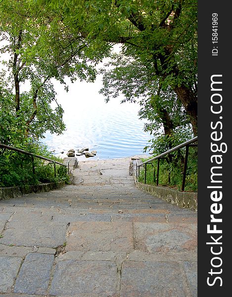 Stone steps conducing to water on nature