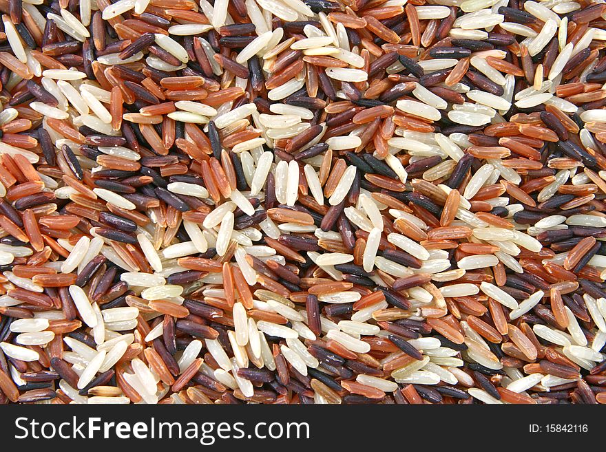 Closeup of Thai Whit Red Jasmine and Fragment magenta rice, Trois Amis Organic, Background texture surface pattern. Closeup of Thai Whit Red Jasmine and Fragment magenta rice, Trois Amis Organic, Background texture surface pattern.