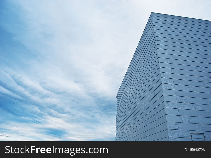 Walls of Oslo Opera House with a blue sky in a background