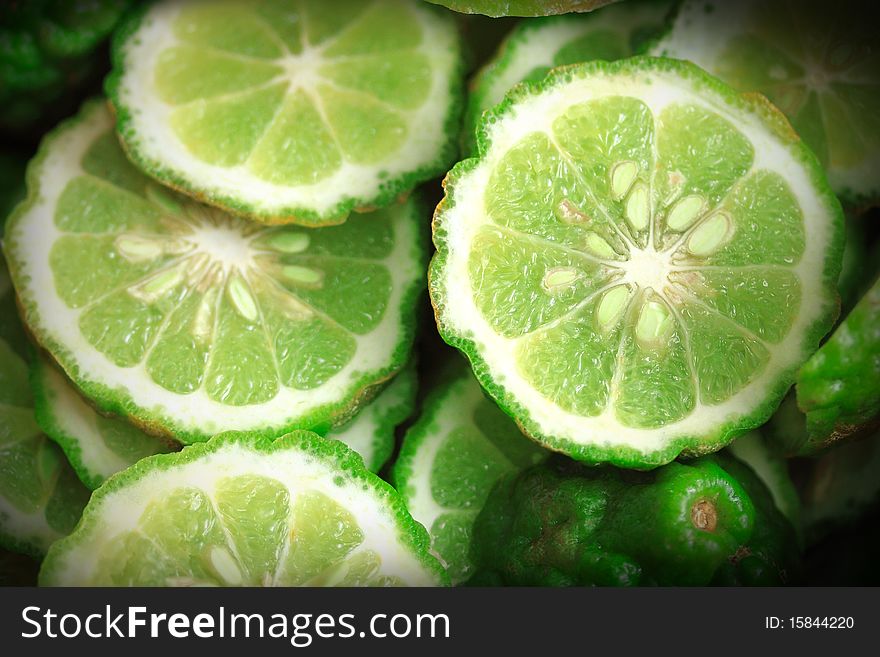 Many green lime slices look sour