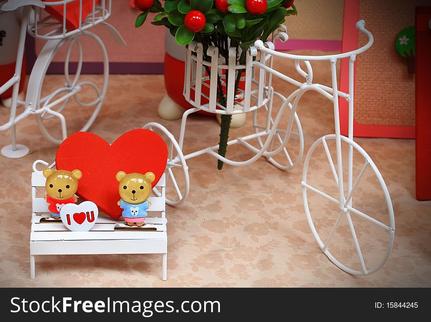 Two bears on chair in garden. Two bears on chair in garden