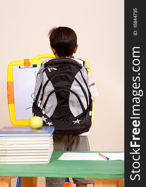 Rear view of a young student with back pack. Rear view of a young student with back pack