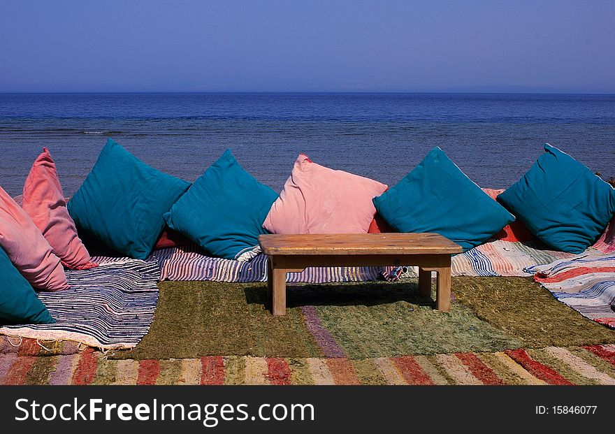 Scenery of table and sofa by the sea. Scenery of table and sofa by the sea
