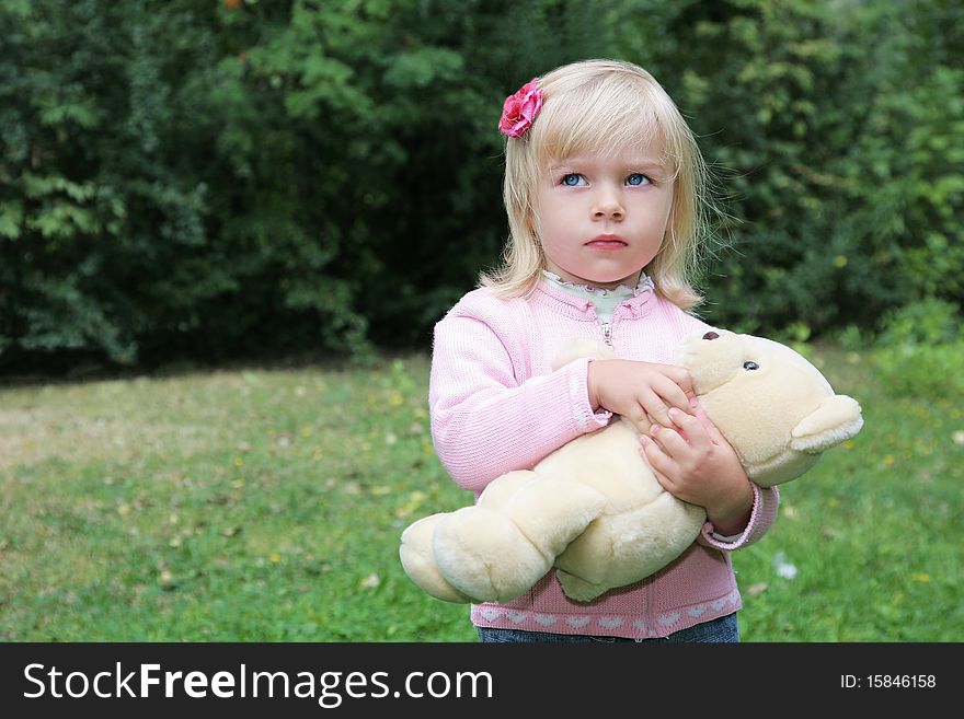 Portrait of cute little girl with blue eyes and blond hair outdoor shot. Portrait of cute little girl with blue eyes and blond hair outdoor shot