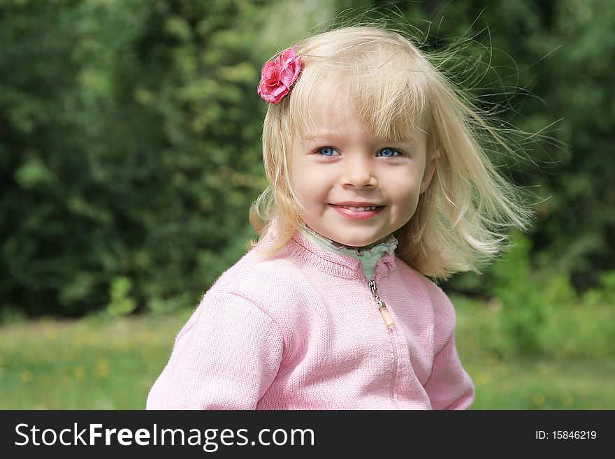 Beautiful girl with flower in her hair