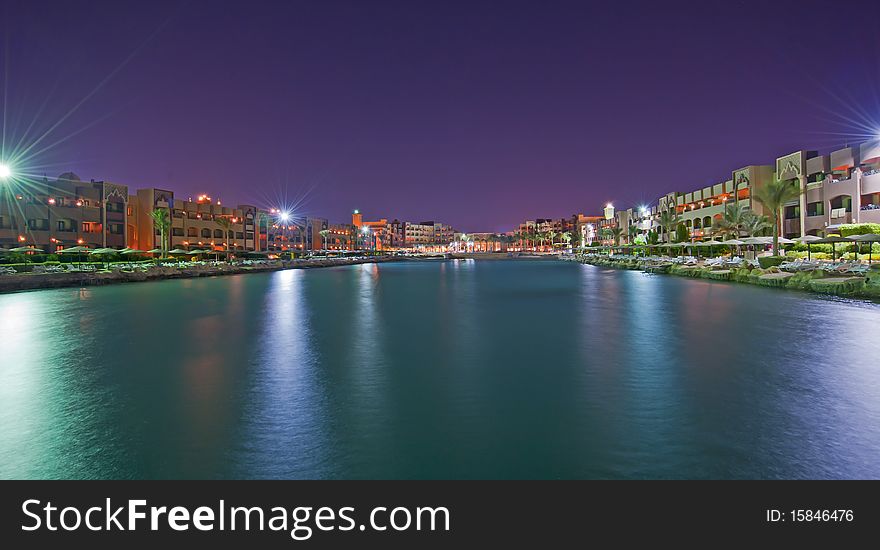 View of a hotel lagoon at night