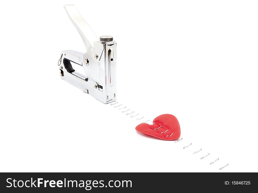 Heart stapler nailed to the horizontal surface. Heart stapler nailed to the horizontal surface.