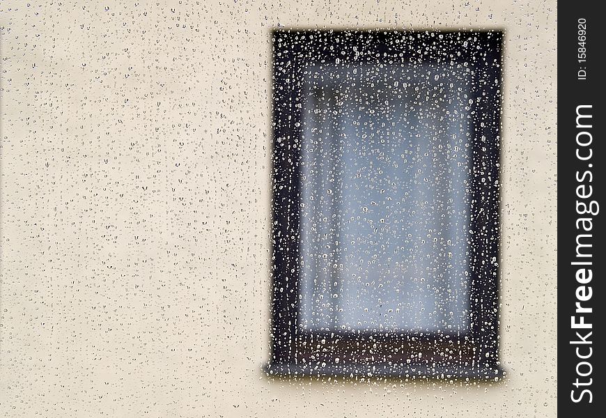 The photo shows a dripping wet window on a rainy day