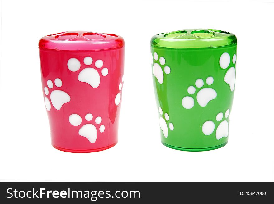 Two cute cups with pet footprints on white. Two cute cups with pet footprints on white.