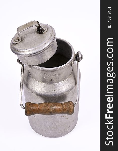 Studio shot of an old and worn out milk can with a handle. Studio shot of an old and worn out milk can with a handle
