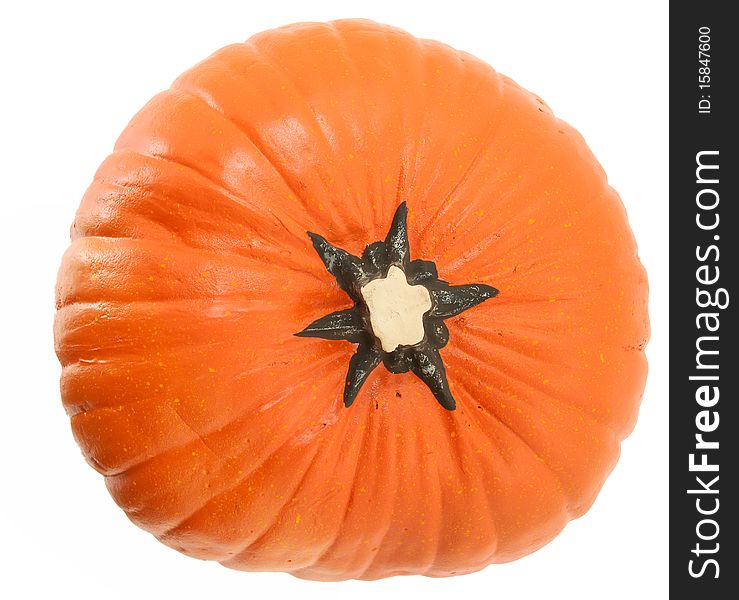 Artificial pumpkin made of styrofoam and paint. Top view over white background. Artificial pumpkin made of styrofoam and paint. Top view over white background.