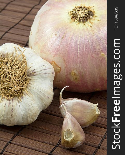 Garlic and onion with brown background