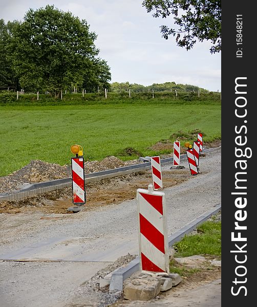 Reconstruction signs and barriers in the middle of the road. Reconstruction signs and barriers in the middle of the road