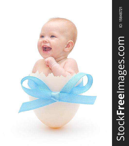 Baby boy in egg on white background