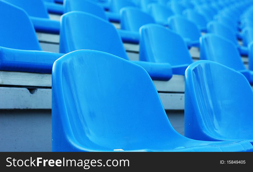 Empty blue plastic football stadium seats. Empty blue plastic football stadium seats