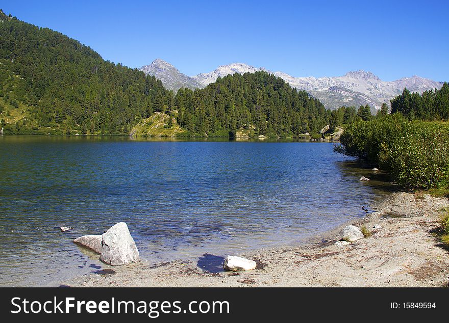 Alpine lake Cavloc Engadine in Switzerland