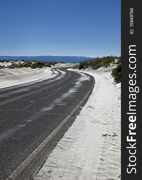 The lone road through the White Sands National Monument. The lone road through the White Sands National Monument