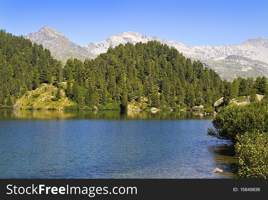 Alpine lake Cavloc Engadine in Switzerland