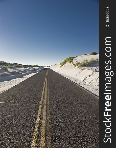 The lone road through the White Sands National Monument. The lone road through the White Sands National Monument