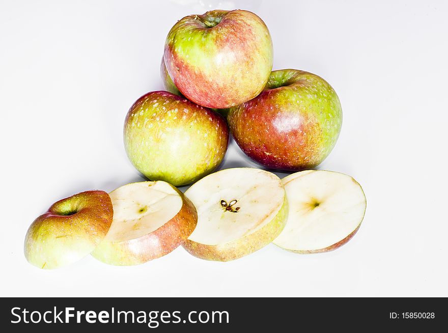 Apples and apple slices isolated on white background