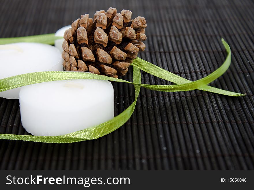 White candles on black background with cone. White candles on black background with cone