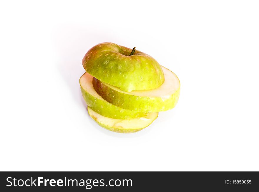 Fresh green apple slices isolated on white