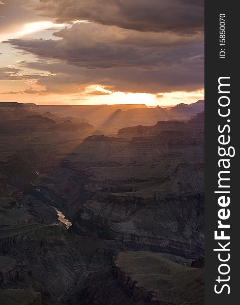 Sunbeams cut through the evening mist in the Grand Canyon. Sunbeams cut through the evening mist in the Grand Canyon