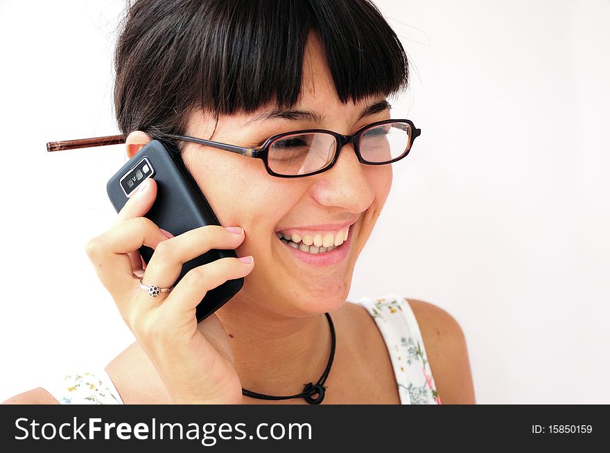 Image of a young woman talking on her mobile telephone. Image of a young woman talking on her mobile telephone