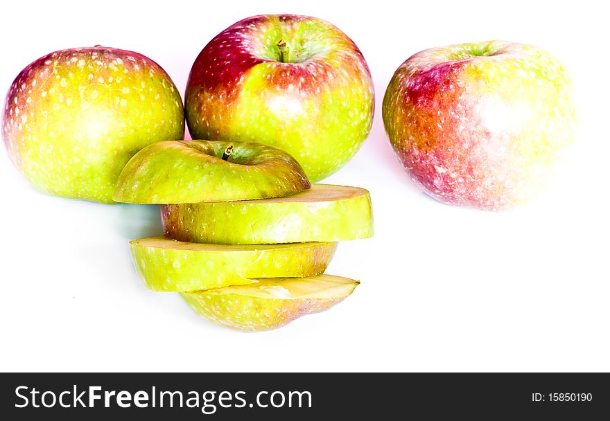 Slices and entire apples isolated on white. Slices and entire apples isolated on white