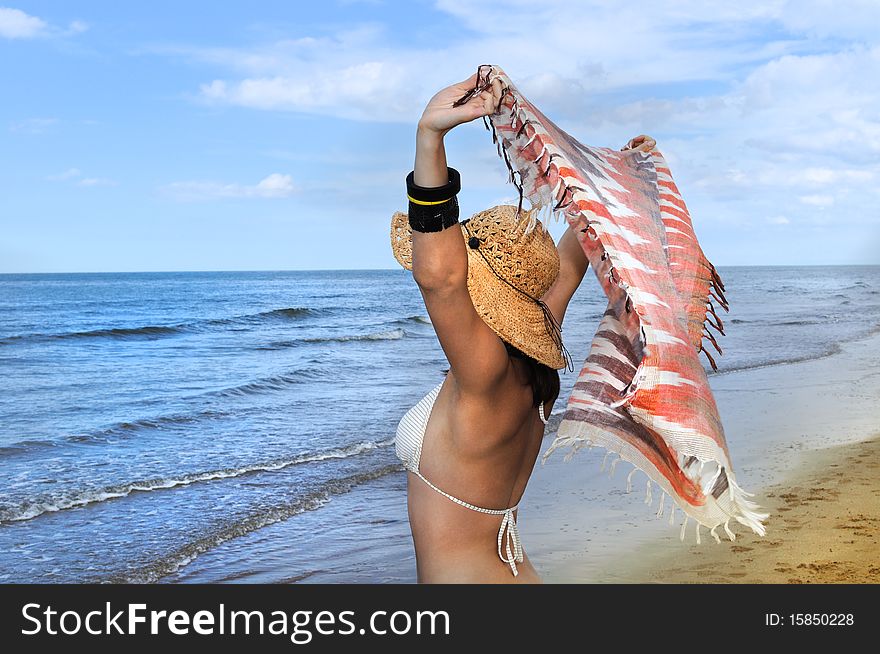 Young Woman Relaxing On The Beach