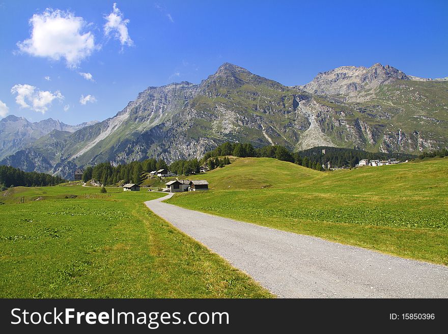 Swiss mountains and meadows with huts typical. Swiss mountains and meadows with huts typical