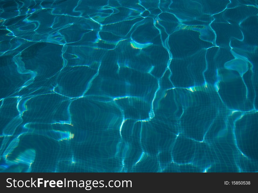 View of a swimming pool water surface. Photo taken with a polarizer filter. View of a swimming pool water surface. Photo taken with a polarizer filter.