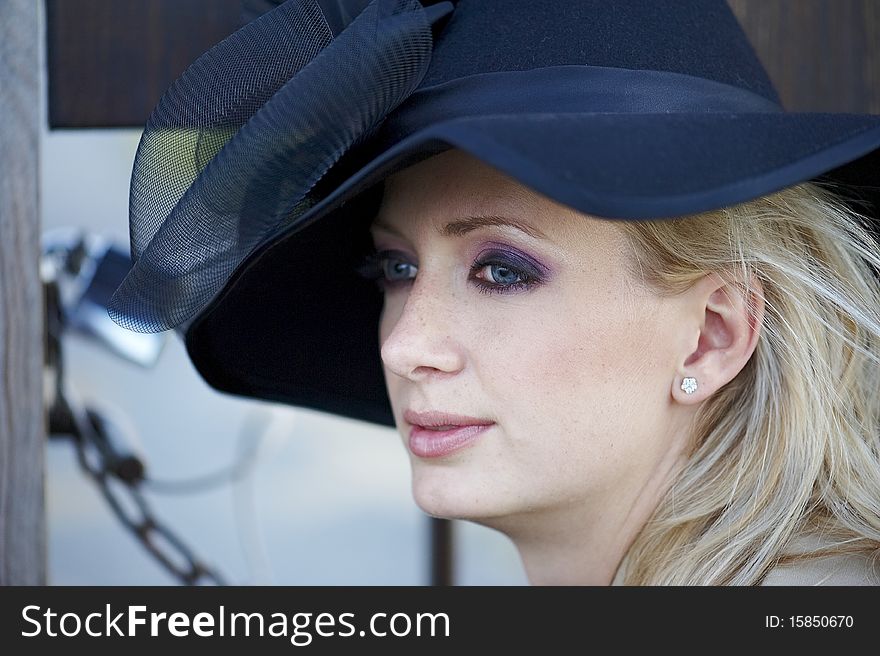 Blonde Woman With Black Hat