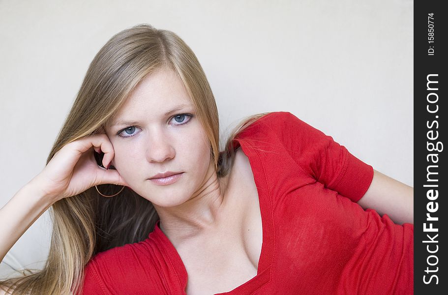 Cute Thoughtful Girl In Red Blouse