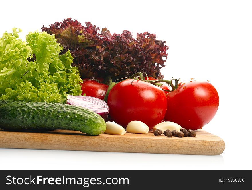 Fresh vegetables on wooden hardboard with space for text