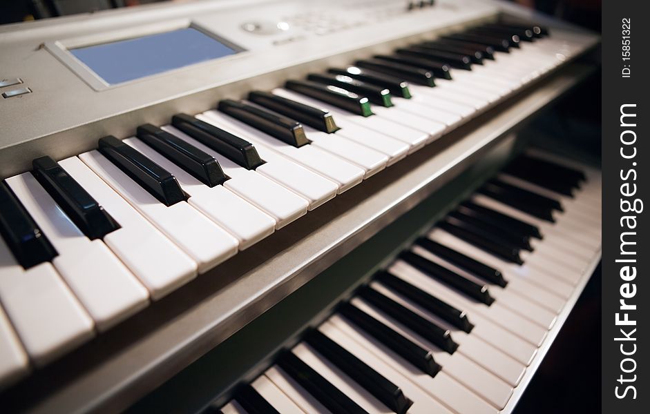 Close up image of two pianos