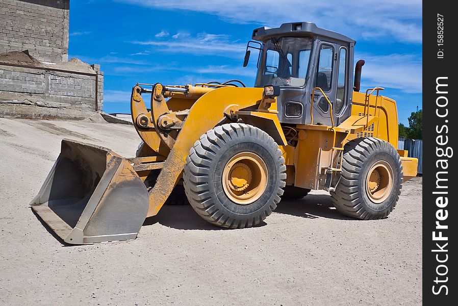 Yellow Loader at a construction site.