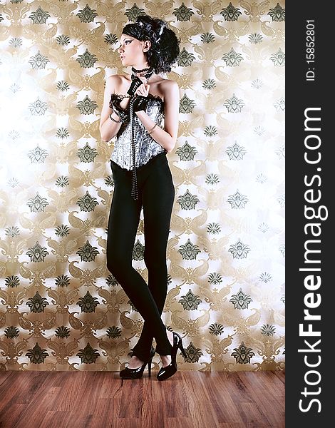 Beautiful fashionable woman over vintage background. Beautiful fashionable woman over vintage background.