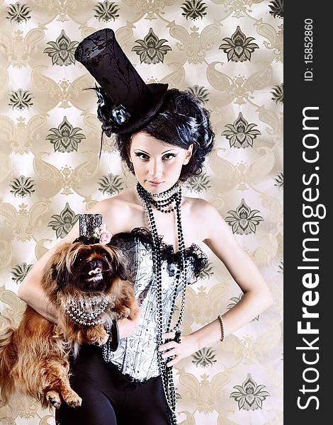 Portrait of a fashionable lady with a dog over vintage background. Portrait of a fashionable lady with a dog over vintage background.