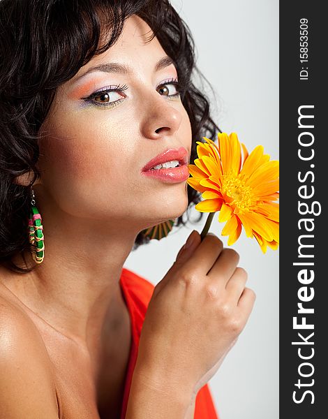 Beautiful woman with flower at studio