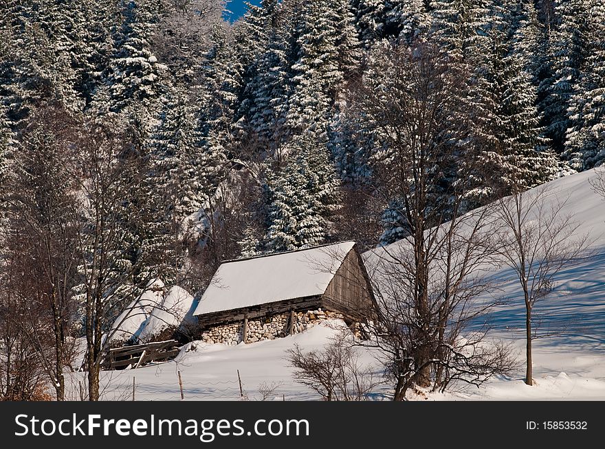 Mountain House In Winter Landscape