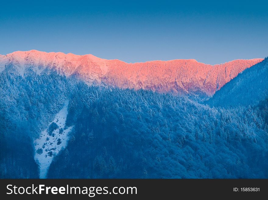 Sunrise In Winter Mountains
