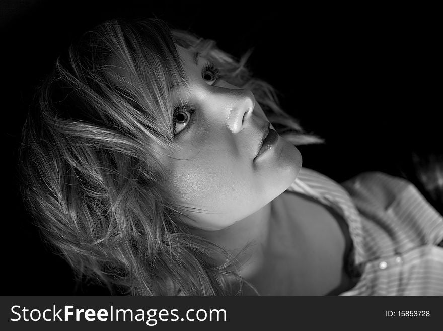 Beautiful blond woman on black background in BW. Beautiful blond woman on black background in BW