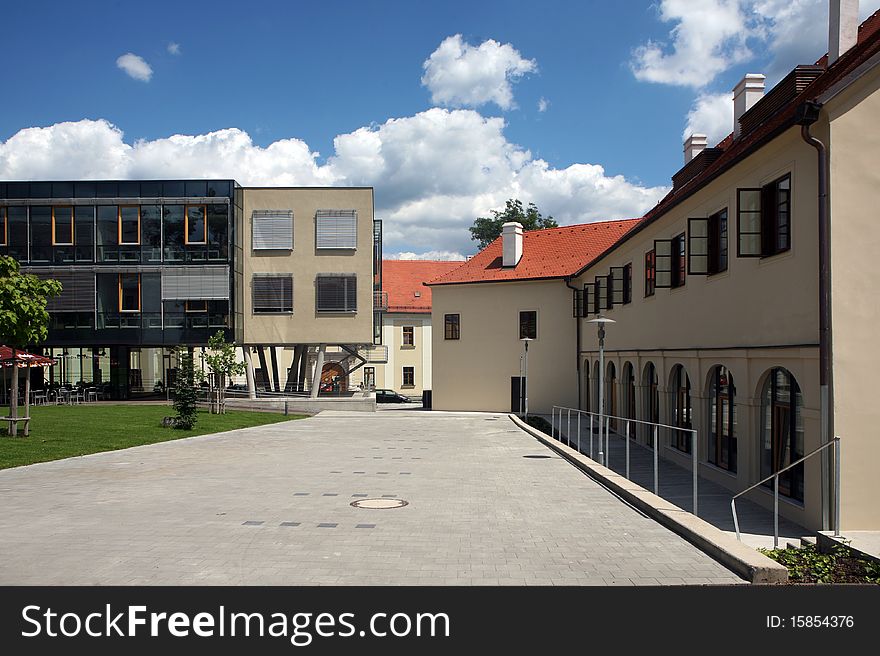 Modern building next to the historical building in center of Brno