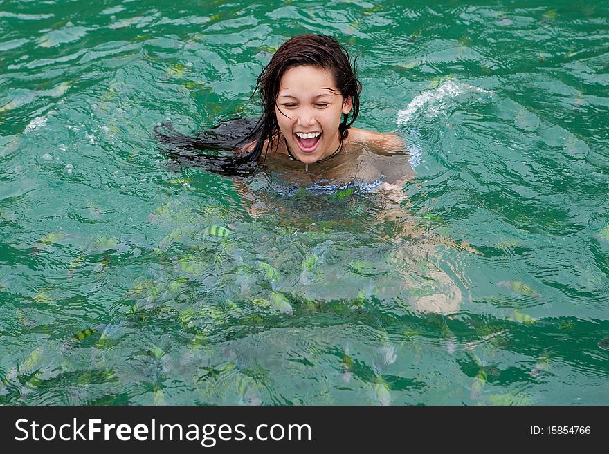 Girl Swims With Tropical Fish